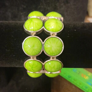 Bright green bracelet with silver trim